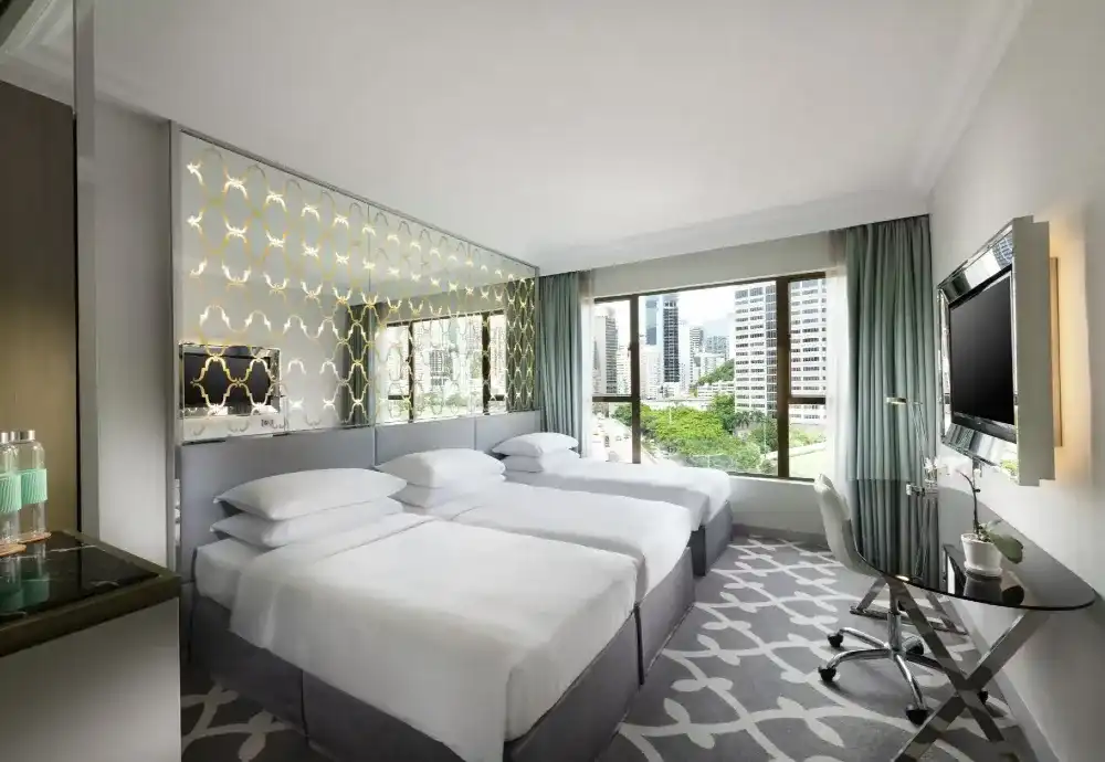 Spacious interior of Deluxe Triple Room at Dorsett Wanchai